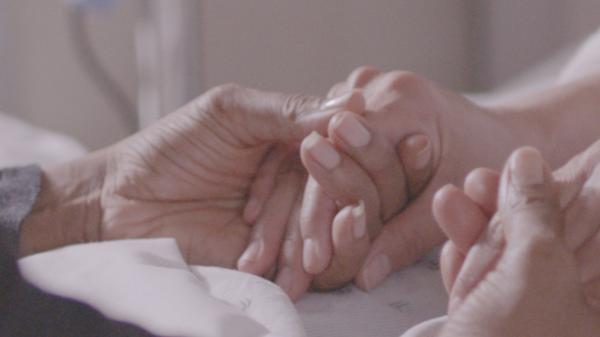 Patient and caregiver shaking hands