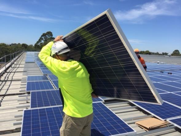 Man carrying a solar panel